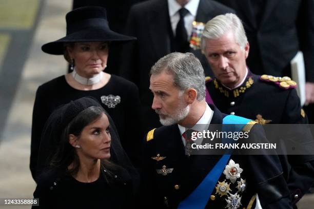 Spain's King Felipe VI and Queen Letizia walk with Belgium's King Philippe and Queen Mathilde as they leave Westminster Abbey in London on September...