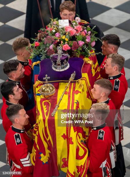 The pall bearers lead the coffin away during the State Funeral of Queen Elizabeth II at Westminster Abbey on September 19, 2022 in London, England....