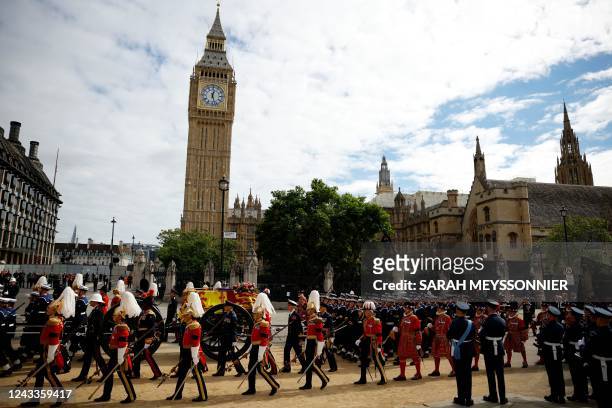 The coffin of Britain's Queen Elizabeth is carried in the procession on the day of the state funeral and burial of Britain's Queen Elizabeth, at...