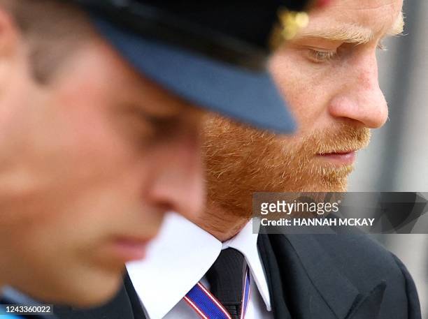 Britain's Prince William, Prince of Wales and Britain's Prince Harry, Duke of Sussex attend the State Funeral of Britain's Queen Elizabeth II in...