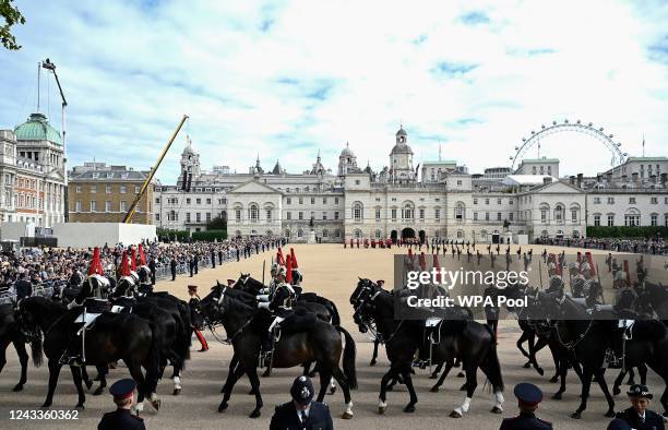 On September 19, 2022 in London, England. LONDON, ENGLAND Members of the Household cavalry prepare ahead of the Procession of the coffin of Queen...