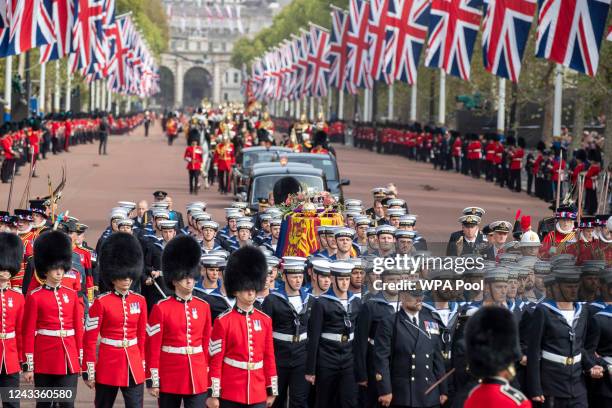 The coffin of Queen Elizabeth II is transported along the Mall following the State Funeral of Queen Elizabeth II at Westminster Abbey on September...