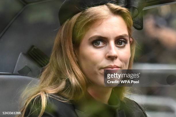 Princess Beatrice of York follows the coffin of Queen Elizabeth II, draped in the Royal Standard, as it travels on the State Gun Carriage of the...