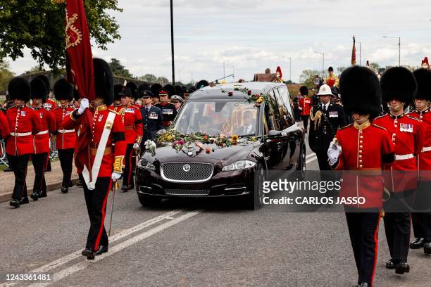 The Procession following the coffin of Queen Elizabeth II, aboard the State Hearse, arrives at The Long Walk in Windsor on September 19 to make its...