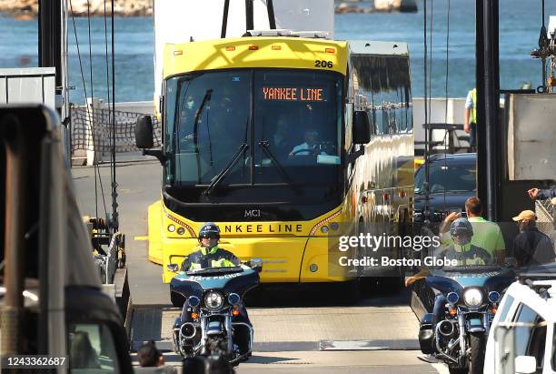 Woods Hole, MA A bus carrying Venezuelan migrants from Marthas Vineyard arrives off of a freight ferry in Woods Hole.