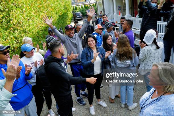 Martha's Vineyard, MA Venezuelan migrants and volunteers celebrate together outside of St. Andrew's Parish House. Two planes of migrants from...