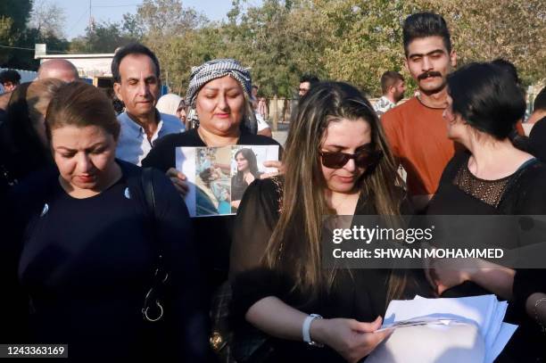 Iraqi and Iranian Kurds, residing in northern Iraq, march near a park in the Iraqi Kurdish city of Sulaimaniya on September 19 against the death of...