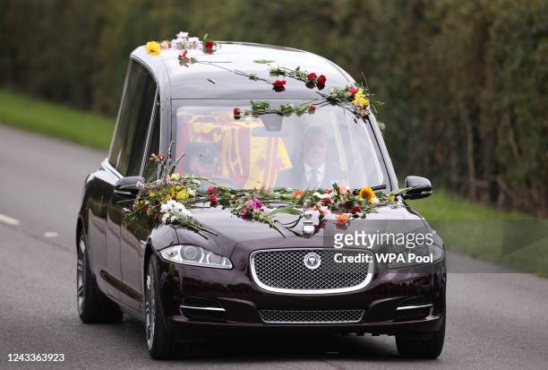 The coffin of Queen Elizabeth II is carried in the state hearse as it drives along Albert Road on September 19, 2022 in Windsor, England. The...
