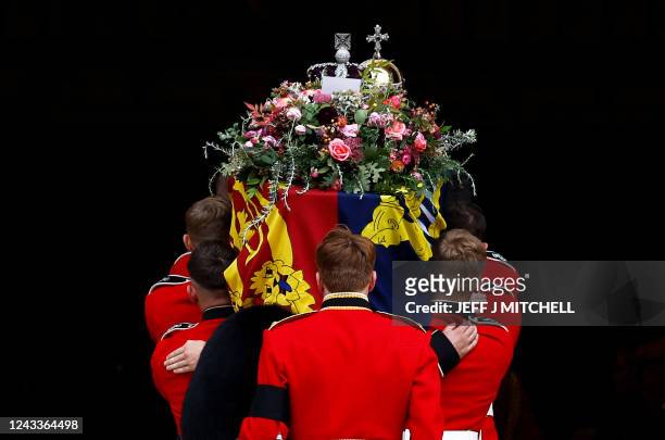 The Bearer Party take the coffin of Queen Elizabeth II, from the State Hearse, into St George's Chapel inside Windsor Castle on September 19 for the...