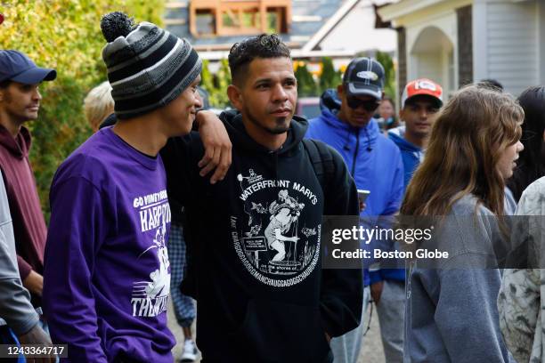 Martha's Vineyard, MA Venezuelan migrants gather outside of St. Andrew's Parish House. Two planes of migrants from Venezuela arrived suddenly two...