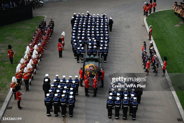 The Bearer Party transfer the coffin of Queen Elizabeth II, draped in the Royal Standard, into the State Hearse at Wellington Arch following the...