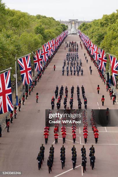 The coffin procession heads down The Mall during the State Funeral of Queen Elizabeth II at Westminster Abbey on September 19, 2022 in London,...