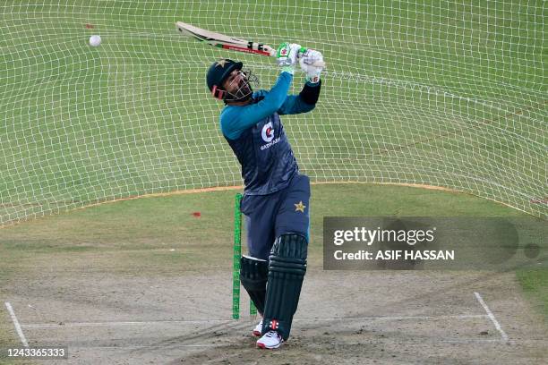 Pakistan's Mohammad Rizwan bats in nets during a practice session at the National Cricket Stadium in Karachi on September 19 on the eve of their...