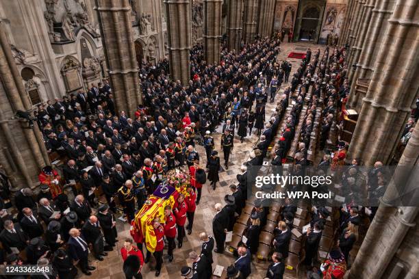 The coffin of Queen Elizabeth II carried by pallbearers at the State Funeral of Queen Elizabeth II, held at Westminster Abbey, on September 19, 2022...