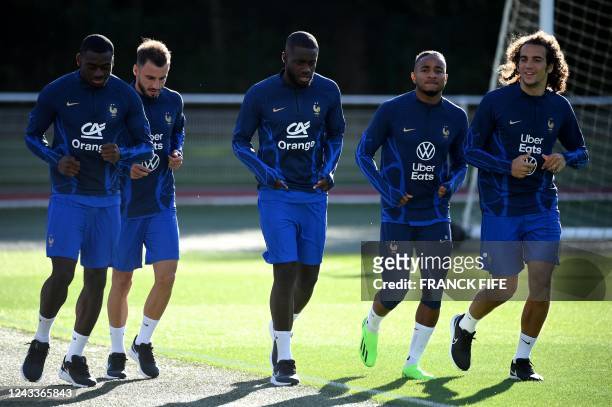 France's midfielder Youssouf Fofana, France's defender Jonathan Clauss, France's defender Dayot Upamecano, France's forward Christopher Nkunku and...