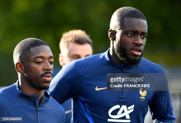France's forward Ousmane Dembele and France's defender Dayot Upamecano take part in a training session in Clairefontaine-en-Yvelines on September 19,...