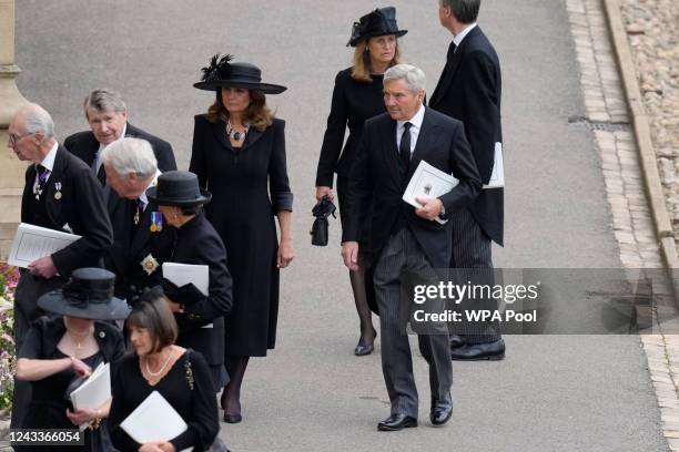 Carol and Michael Middleton, parents of Kate, Princess of Wales, arrive ahead of the Committal Service for Queen Elizabeth II on September 19, 2022...