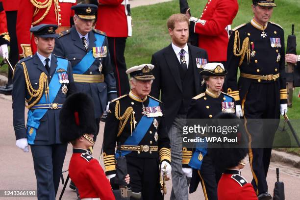 King Charles III, Princess Anne, Princess Royal, Prince William, Prince of Wales, and Prince Harry, Duke of Sussex, follow the hearse carrying the...