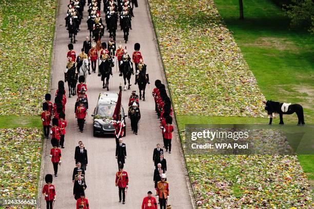 Emma, the monarch's fell pony, stands as the Ceremonial Procession of the coffin of Queen Elizabeth II arrives at Windsor Castle ahead of the...