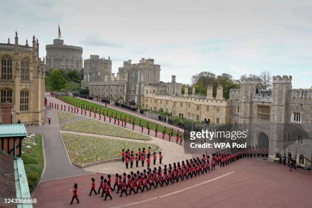 Royal Grenadier guards march onto Windsor Castle grounds in anticipation of the arrival of the coffin of Queen Elizabeth II on September 19, 2022 in...