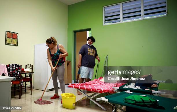 Carla Colón takes refuge at the Carlos Colón Burgos Public High School with her two sons Jorge and Aldo after Hurricane Fiona hit the island on...