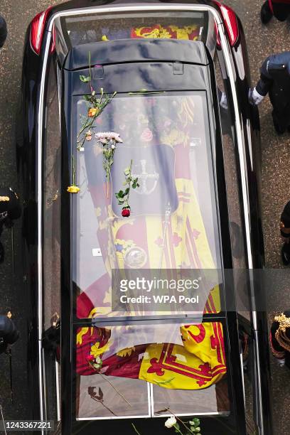 Flowers on the hearse carrying the coffin of Queen Elizabeth II as it arrives at Windsor Castle for the Committal Service in St George's Chapel on...