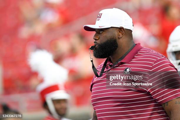 Florida State Seminoles offensive coordinator Alex Atkins blows a whistle as players warm up for the college football game between the Florida State...