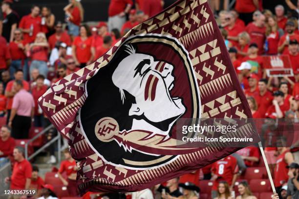 Florida State Seminoles logo is seen on a flag as the team runs onto the field before the start of the college football game between the Florida...