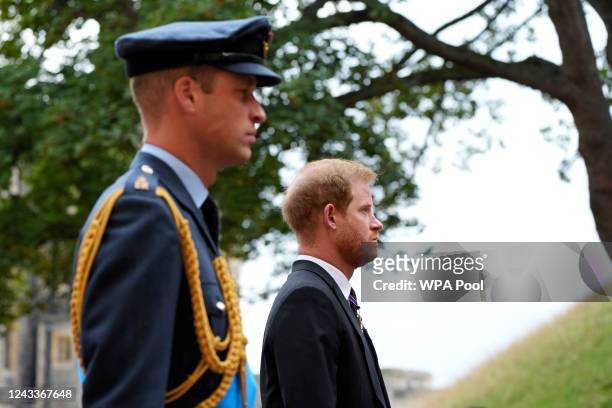 Rince Harry and Prince William, left, follow the hearse with the coffin of Queen Elizabeth II moving towards St. George's Chapel on September 19,...