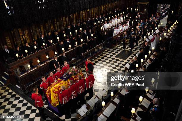 The coffin of Queen Elizabeth II, followed by King Charles III, the Queen Consort, the Princess Royal, Vice Admiral Sir Tim Laurence, the Duke of...