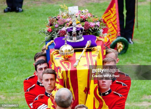 Coffin bearers carry the coffin of Queen Elizabeth II into St George's Chapel on September 19, 2022 in Windsor, England. The committal service at St...