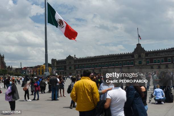 People remain at Zocalo square after an earthquake in Mexico City on September 19, 2022. 8-magnitude earthquake struck western Mexico on Monday,...