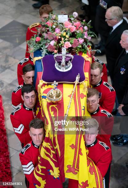 King Charles III and members of the royal family follow behind the coffin of Queen Elizabeth II, draped in the Royal Standard with the Imperial State...