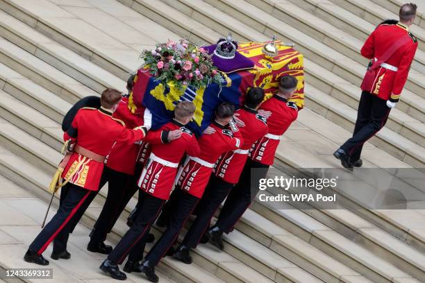 The coffin of Queen Elizabeth II is carried towards Saint George's chapel for the committal service at Windsor Castle on September 19, 2022 in...