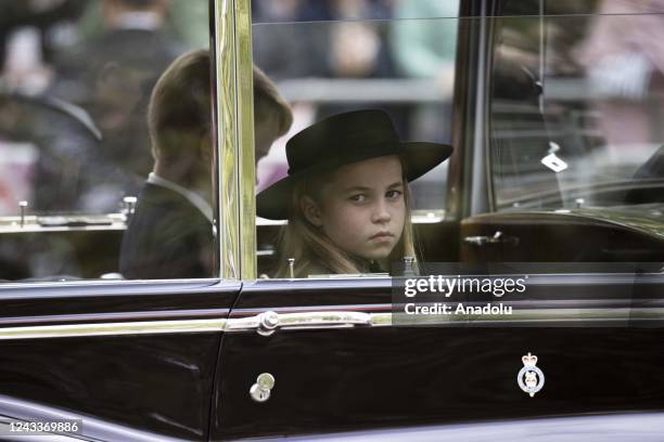 Britain's Prince George of Cornwall and Cambridge and Princess Charlotte of Wales arrive for the State Funeral Service of Britain's Queen Elizabeth...