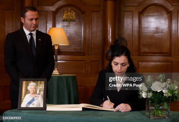 President of Kosovo, Vjosa Osmani, signs a book of condolence at Church House following the State Funeral of Queen Elizabeth II on September 19, 2022...