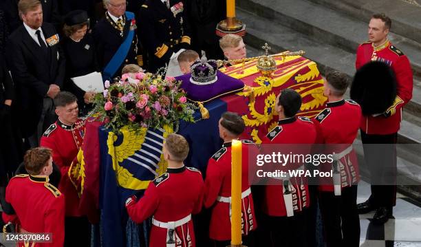 The bearer party with the coffin of Queen Elizabeth II as it is taken from Westminster Abbey on September 19, 2022 in London, England. Elizabeth...