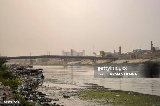 The Tigris river flows under the Ahrar bridge in the central Karkh district of the Iraqi capital Baghdad on July 24, 2022. The Tigris is one of...