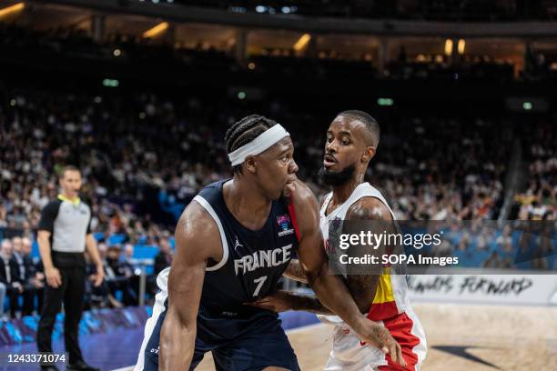 Guerschon Yabusele of France and Lorenzo Brown of Spain in action during the final of the FIBA Eurobasket 2022 between Spain and France at Mercedes...