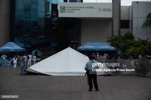 Patients rest outside of the Regional University Hospital after a 7.7 magnitude quake struck the west coast in Michoacan State after a drill to...