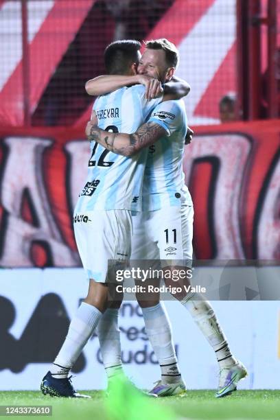 Cristian Menendez of Atletico Tucuman celebrates with teammate Joaquin Pereyra after scoring the second goal of his team during a match between...