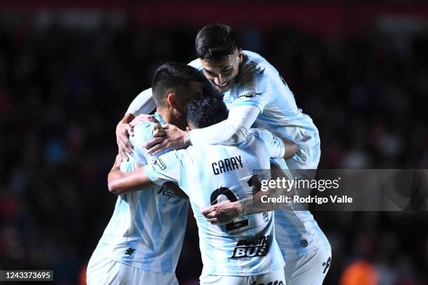 Cristian Menendez of Atletico Tucuman celebrates with teammates after scoring the first goal of his team during a match between Argentinos Juniors...