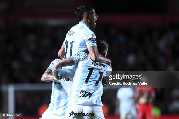 Cristian Menendez of Atletico Tucuman celebrates with teammates after scoring the first goal of his team during a match between Argentinos Juniors...