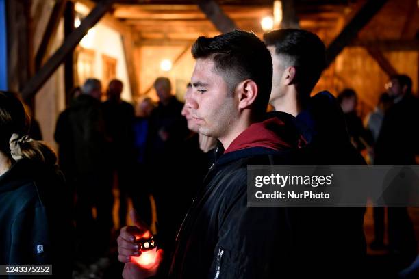 People light candles in the memory of Queen Elisabeth II inside the courtyard of the ''Blue House'' owned by the current sovereign King Charles III...