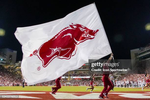 Cheerleader running with the Arkansas Razorbacks flag during the college football game between the Missouri State Bears and Arkansas Razorbacks on...