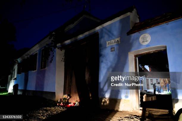 People light candles in front of the ''Blue House'' owned by the current sovereign King Charles III in Viscri, Brasov, Romania. British ambassador...