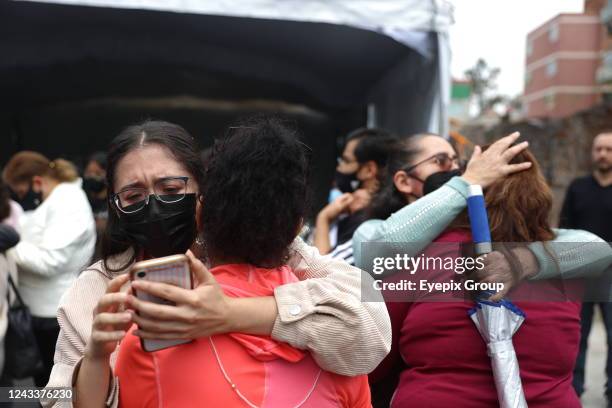 Woman reacts after the earthquake of magnitude 7.7 richter with epicenter in the State of Michoacan on anniversary of two previous tremors to...