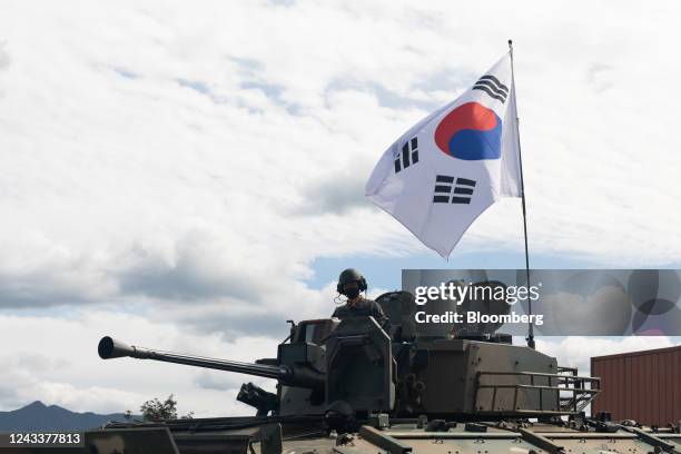 South Korean army soldiers on a tank during a live-fire exercise at the Defense Expo Korea 2022 at a military base in Pocheon, South Korea, on...