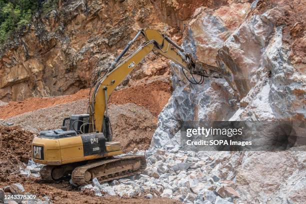 View of the rock mountain drilling process in marble stone quarry in north Moramo. Mountains in the northern Moramo area can be exploited for various...