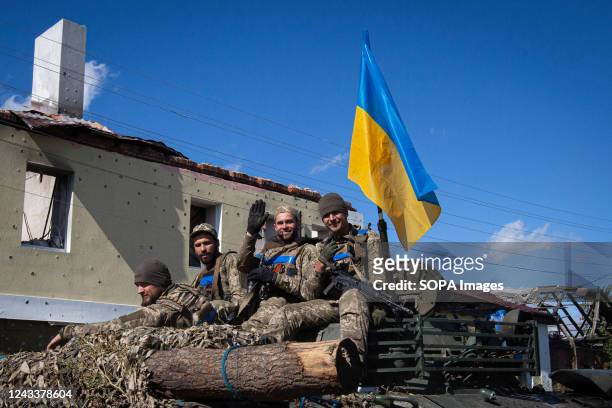 Ukrainian soldiers ride in an armored tank in the town of Izium, recently liberated by Ukrainian Armed Forces, in the Kharkiv region. Russian troops...